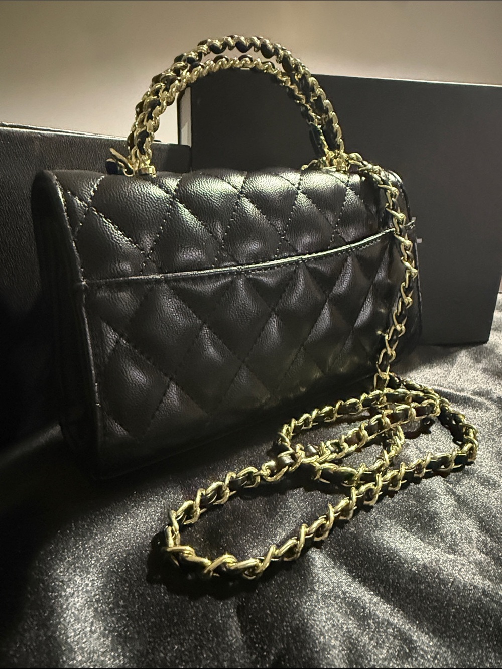 Quilted handbag with gold hardware